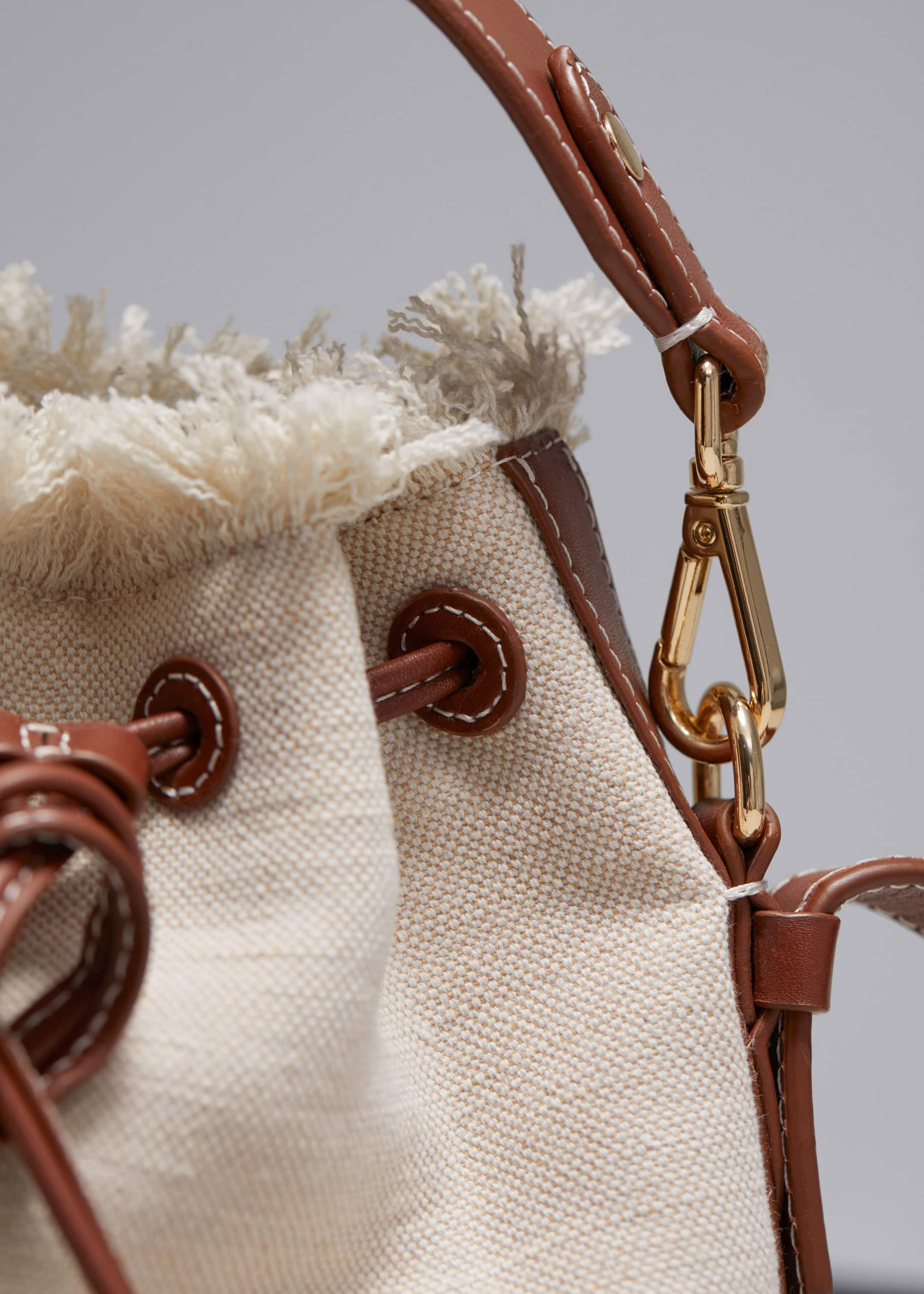 Leather-Trimmed Canvas Bucket Bag - {{variantName}} - Descriptive Detail