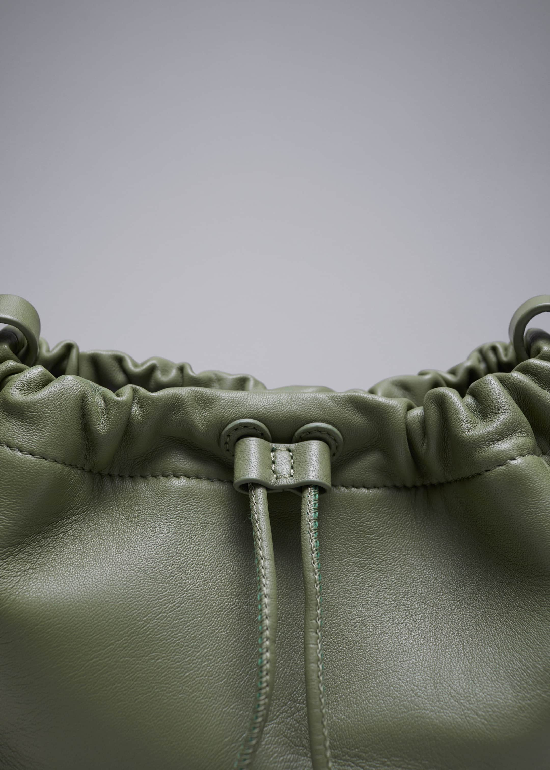 Small Leather Drawstring Tote - {{variantName}} - Descriptive Detail