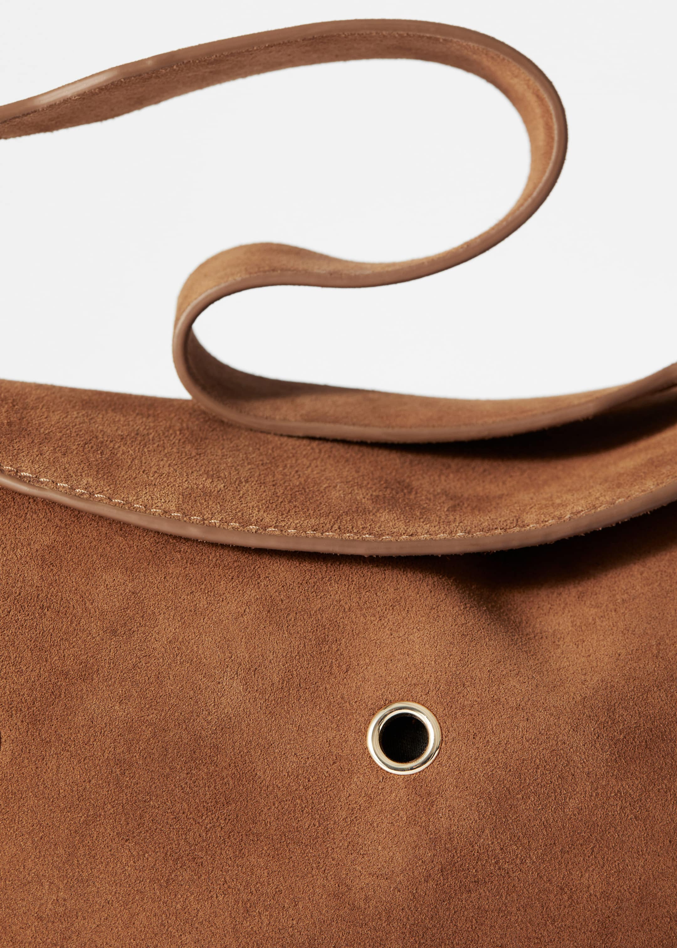 Tasche aus Veloursleder mit Ösen - {{variantName}} - Beschreibendes Detail