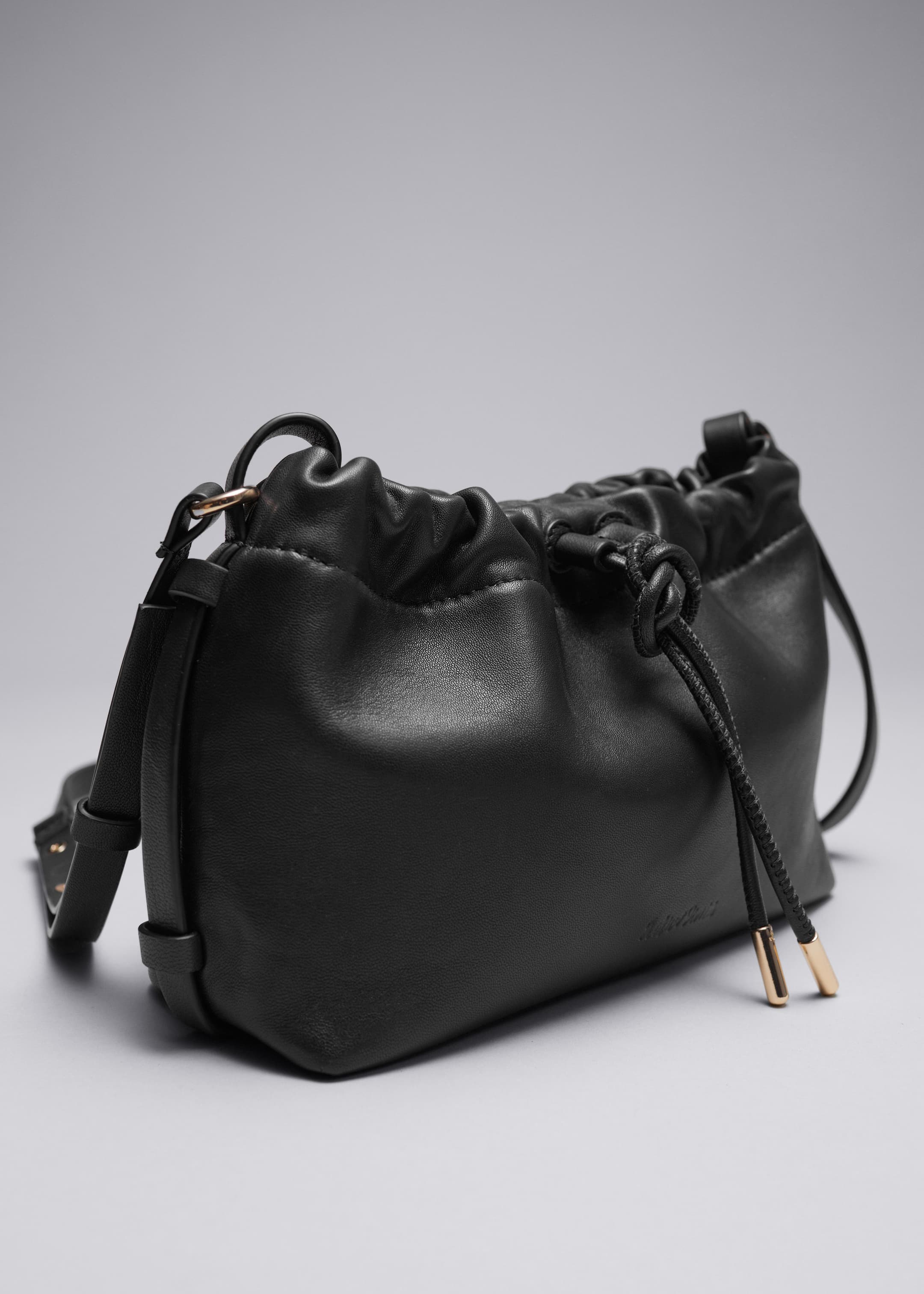 Small Leather Drawstring Tote - {{variantName}} - Descriptive Detail